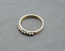 A 9ct rose gold band ring having spherical ball decoration, size Q & approx 2.4g
