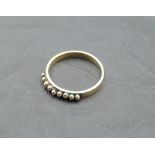 A 9ct rose gold band ring having spherical ball decoration, size Q & approx 2.4g