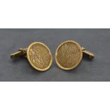 A pair of yellow metal cufflinks stamped 333, having circular panels with textured decoration and