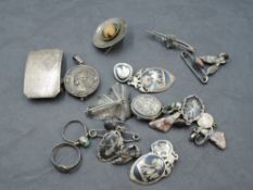 A Sterling silver belt buckle, Islamic white metal signet ring, Art Nouveau silver locket, Silver