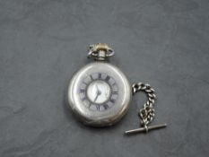 An HM silver half hunter top wound pocket watch by Pinnacle having Roman numeral dial with