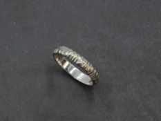 A 9ct white gold wedding band having moulded decoration, size N & approx 2g