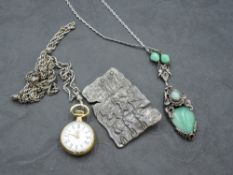 Four pieces of costume jewellery including silver rope chain with watch clip, Egyptian style brooch,