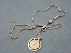 A rose gold fancy link chain stamped 9ct with a 9ct gold medallion bearing monogrammed cartouche,