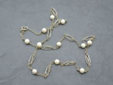 A 9ct gold pearl and fancy link chain, approx 24' & 10.9g