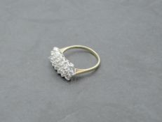 A cubic zirconia dress ring having three rows of stones in a claw set panel on a 9ct gold loop, size