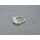 A cubic zirconia dress ring having three rows of stones in a claw set panel on a 9ct gold loop, size