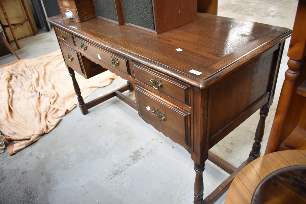 A reproduction oak desk , width approx. 127cm