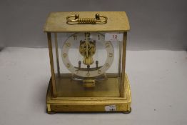 A mid century German made mantel clock by Kieninger & Obergfell having skeleton mechanism