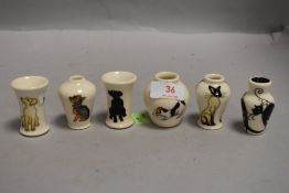 Six modern Moorcroft pottery vase having cat or dog imagery all bearing stamp and signature to base