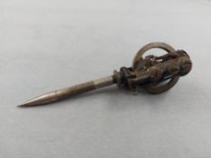An Edison electric pen, having a nickel-plated flywheel stamped 'Patented Aug 15 1876' and