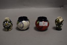 Four modern miniature Moorcroft vases all bearing stamps and marks to bases