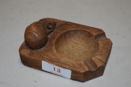 A Robert Thompson Mouseman oak carved ashtray, with carved mouse signature