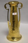 A Edwardian era Art Nouveau design vase with embossed details and twin handles