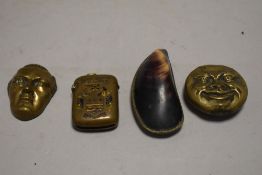 Three Victorian vesta cases or match holders in novelty forms including double sided moon face,