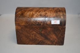 A 19th century figured mahogany dome topped tea caddy