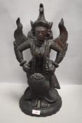 A large hand carved ethnic wood deity or goddess possibly Bali or Indonesian 49cm high