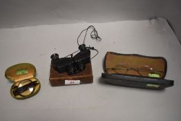 A pair of early 20th century opera glass binoculars by Theatis Wedel and two pairs of spectacles
