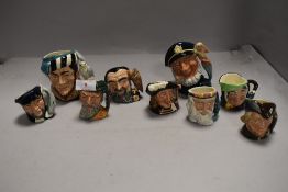 A selection of miniature Royal Doulton character jugs including Merlin and Aramis