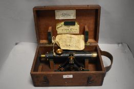 A Stanley three screw level, No 22228 in wooden case with leather handle.