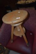 A vintage beech adjustable stool