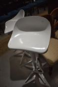 Two retro plastic kitchen bar stools, in white