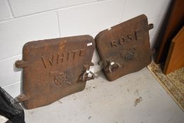 A pair of cast iron boiler doors, from The White Rose Foundry in Yorkshire, with motif to front
