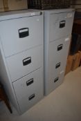 Two modern four drawer filing cabinets
