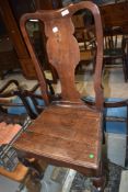 A period oak dining chair, having vase back and solid seat, cabriole legs to front