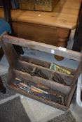 A wooden tool trug and contents