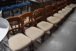 A set of eleven Victorian elm rail back dining chairs, circa 1860 with restoration.