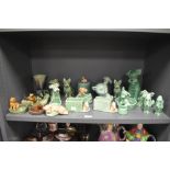 20th century Sylvac and Wade figures including pipe holders, green glaze dogs and similar