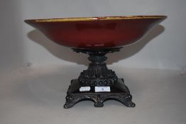 Modern footed fruit bowl having ceramic bowl on bronze effect base