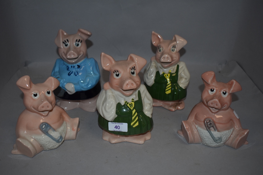 A family of 20th century Wade ceramic Nat West piggy banks