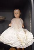 Composite doll made in England having talk box and closing eyes