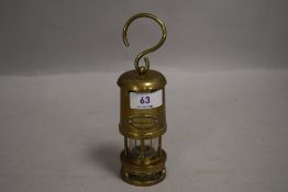 20th century miniature miners lamp bearing label for E Thomas & Williams