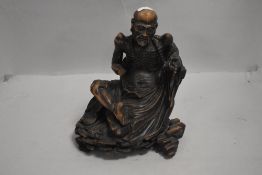 19th century Tibetan/Chinese wooden carved figure of an emaciated Immortal having historic damage