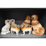 Victorian and later Staffordshire flat back dogs including mirrored pair of Bavarian Monkey face
