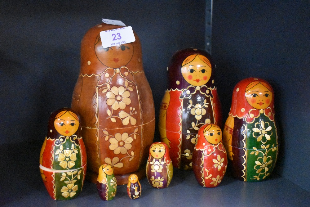 A set of seven Russian Soviet era hand decorated nesting dolls plus one