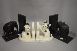 Bookends Mid Century and later one pair of ceramics dogs and tribal ethnic wood carved elephant set