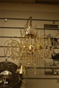20th century clear cut crystal glass and brass framed chandelier