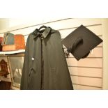 A 20th century graduation gown and mortar board cap