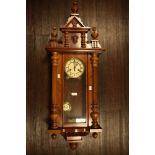 Edwardian Vienna style wall clock with stained wood case and enamel dial