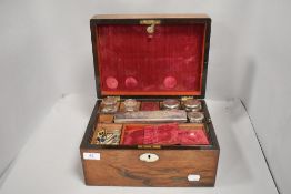 Victorian walnut cased sewing box with velvet lined compartments housing dressing table set and