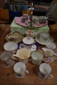 A collection of decorative vintage and antique cups and jugs, also included is a handled cake