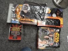A Star Wars saga edition chess set with Trivial Pursuit, Collectors card, T shirt and a collection