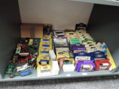 A shelf of modern diecasts including, Lledo, Atlas, Matchbox and similar most boxed or on cards,