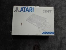 An Atari 520ST Computer Keyboard with Mouse, leads and manual, with inner polystyrene packaging