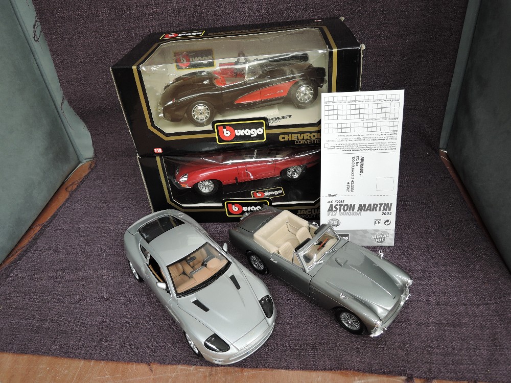 Four 1:18 scale diecasts, Burago 3034 Chevrolet Corvette 1957 and 3016 Jaguar E Cabriolet 1961, both