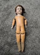 An early 20th century MOA Welsch 250 Germany bisque headed doll having sleep eyes, open mouth,